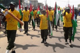 Protesters bearing Palestinian flags march on the streets during a demonstration in support of Palestinian people and to condemn Israel's offensive in Gaza, in the northern Nigerian city of Kano, on July 25, 2014. Hundreds of thousands of demonstrators, under the auspices of pro-Iranian shiite group the Islamic Movement of Nigeria, marched through the streets of the ancient city denouncing the Israeli incursion into Gaza an its war with Hamas, which has claimed over 800 Palestinian lives and killed 35 Israelis. Similar protests were held in several northern Nigerian cities. AFP PHOTO / AMINU ABUBAKAR