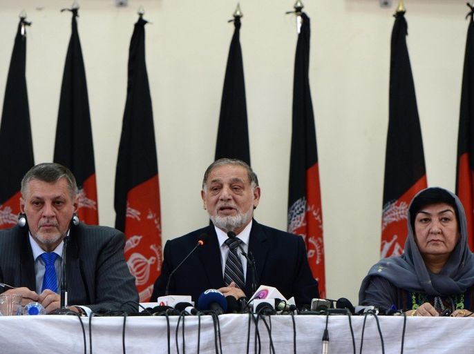 Afghan Independent Election Commission (IEC) head, Ahmad Yousuf Nuristani (C) speaks as head of the UN mission to Afghanistan, Jan Kubis (L) looks on during a press conference in Kabul on July 31, 2014. Afghanistan's floundering attempts to declare a winner of its presidential election inched forward with a deal allowing an audit of all votes to restart, but the United Nations warned of the risk of further delays. Alleged fraud during the June 14 election has plunged the country into a crisis as US-led troops wind down their war against Taliban insurgents and President Hamid Karzai prepares to step down after ruling since 2001. AFP PHOTO/Wakil Kohsar