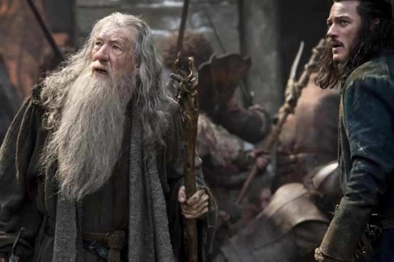 This photo released by Warner Bros. Pictures and Metro-Goldwyn-Mayer Pictures Inc. shows, Ian McKellen, left, as Gandalf The Grey, and Luke Evans as Bard, in the film, "The Hobbit: The Battle of the Five Armies." The movie releases in the U.S. on Dec. 17, 2014. (AP Photo/Warner Bros. Pictures, Mark Pokorny)