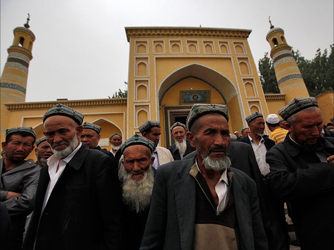 epa03728835 (11/18) Muslim men of the Uighur ethnic group leave the Id Kah Mosque after Friday prayers in Kashgar, Xinjiang Uighur Autonomous Region, China, 24 May 2013. Uighurs, a Muslim ethnic minority group in China, make up about 40 per cent of the 21.8 million people in Xinjiang, a vast, ethnically divided region that borders Pakistan, Afghanistan, Kazakhstan, Kyrgyzstan and Mongolia. Other ethnic minorities living in the region include the Han Chinese, Kyrgyz, Mongolian and Tajik
