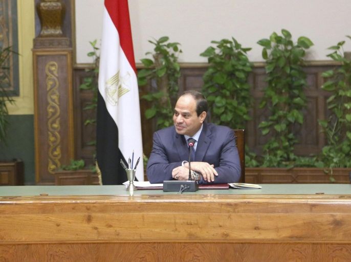 Egypt's President Abdel Fattah al-Sisi (C) speaks during a meeting with local journalists at the Presidential Palace in Cairo in this July 6, 2014 handout photo provided by the Egyptian Presidency. Sisi said he wished the imprisoned Al Jazeera journalists, convicted of aiding "a terrorist group", had been deported and not put on trial, a newspaper reported on Monday. REUTERS/The Egyptian Presidency/Handout via Reuters (EGYPT - Tags: POLITICS CRIME LAW MEDIA) ATTENTION EDITORS - THIS PICTURE WAS PROVIDED BY A THIRD PARTY. REUTERS IS UNABLE TO INDEPENDENTLY VERIFY THE AUTHENTICITY, CONTENT, LOCATION OR DATE OF THIS IMAGE. FOR EDITORIAL USE ONLY. NOT FOR SALE FOR MARKETING OR ADVERTISING CAMPAIGNS. NO SALES. NO ARCHIVES. THIS PICTURE IS DISTRIBUTED EXACTLY AS RECEIVED BY REUTERS, AS A SERVICE TO CLIENTS