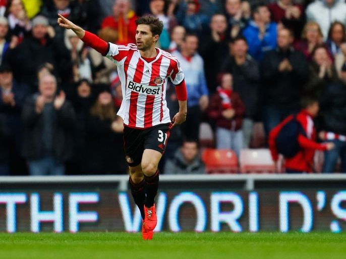 SUNDERLAND, ENGLAND - MAY 11: Fabio Borini of Sunderland celebrates as he scores their first goal during the Barclays Premier League match between Sunderland and Swansea City at Stadium of Light on May 11, 2014 in Sunderland, England.