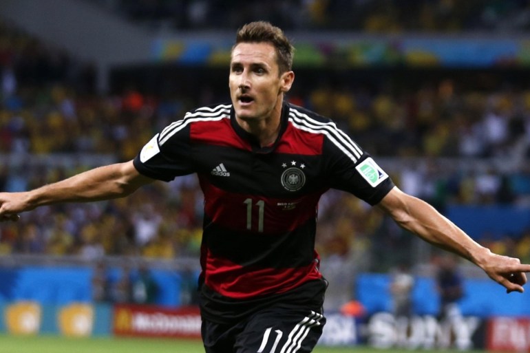 Germany's Miroslav Klose celebrates after scoring a goal during the 2014 World Cup semi-finals between Brazil and Germany at the Mineirao stadium in Belo Horizonte July 8, 2014. REUTERS/Marcos Brindicci (BRAZIL - Tags: TPX IMAGES OF THE DAY SOCCER SPORT WORLD CUP) TOPCUP