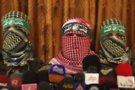 Hamas' armed wing spokesman (C) speaks during a news conference in Gaza City July 3, 2014. The spokesman said Israel was breaking the 2012 ceasefire agreement and the group would act according to developments on the ground. He said Israel would pay a heavy price in any upcoming war. Israel said on Thursday it was beefing up its forces along its frontier with the Gaza Strip, in what it called a defensive deployment in response to persistent Palestinian cross-border rocket attacks. REUTERS/Mohammed Salem (GAZA - Tags: POLITICS CIVIL UNREST)