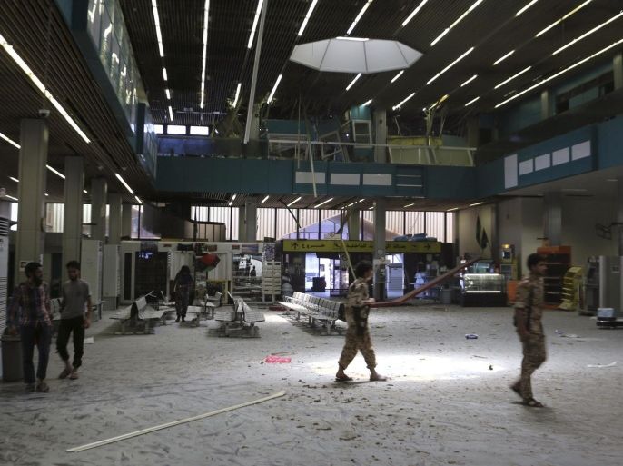 The inside of a damaged terminal is seen after a shelling at Tripoli International Airport July 17, 2014. Several shells hit the terminal of Libya's main airport on Thursday as rival militias fought in Tripoli for a fifth day, and gunmen assassinated a female politician in the east. Tripoli International Airport has been a battlefield since fighters attacked it with heavy guns on Sunday to wrest control from a rival militia which has been based there since the fall of Libya's late ruler Muammar Gaddafi in 2011. REUTERS/Hani Amara (LIBYA - Tags: TRANSPORT CIVIL UNREST POLITICS)