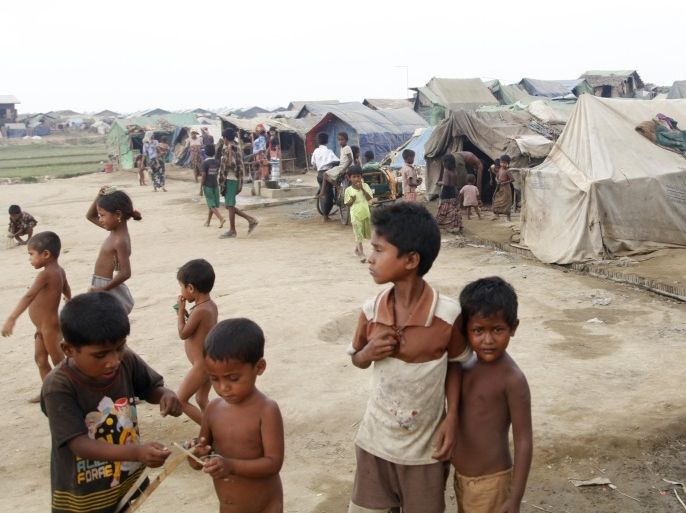 Muslim children, who identify themselves as long-persecuted “Rohingya” Muslims, play outside their tents at Da Paing camp for Muslim refugees in north of Sittwe, Rakhine State, western Myanmar, Wednesday, April 2, 2014. Myanmar, a predominantly Buddhist nation, only recently emerged from a half-century of military rule. Though it is carrying out its first census in 30 years, hundreds of thousands of members of the Muslim minority are likely to go uncounted. (AP Photo/Khin Maung Win)