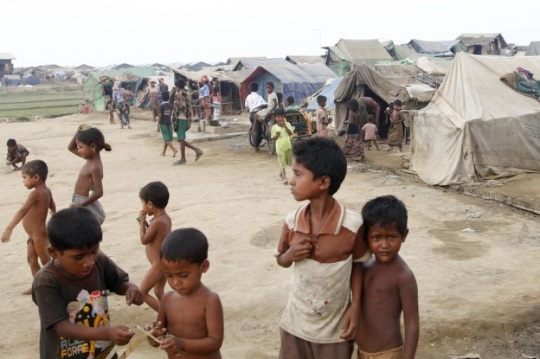 Muslim children, who identify themselves as long-persecuted “Rohingya” Muslims, play outside their tents at Da Paing camp for Muslim refugees in north of Sittwe, Rakhine State, western Myanmar, Wednesday, April 2, 2014. Myanmar, a predominantly Buddhist nation, only recently emerged from a half-century of military rule. Though it is carrying out its first census in 30 years, hundreds of thousands of members of the Muslim minority are likely to go uncounted. (AP Photo/Khin Maung Win)