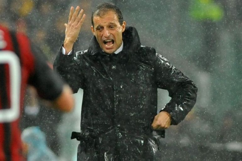 AC Milan coach Massimiliano Allegri gestures during a Serie A soccer match between Juventus and AC Milan at the Juventus stadium, in Turin, Italy, Sunday, Oct. 6, 2013. (AP Photo/Massimo Pinca)
