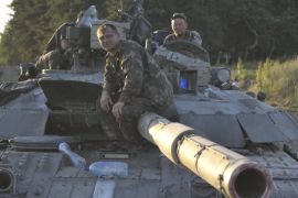 Picture made available 30 June 2014 of Ukrainian solders sitting atop a tank at a position outside Luhansk, Ukraine 29 June 2014. In a bid to end two months of fighting, Ukrainian President Petro Poroshenko and pro-Russian rebels announced earlier on 29 June that the week-long ceasefire that ended Friday was extended until 1900 GMT Monday, 30 June. It was not yet clear if a second extension would be agreed.