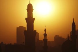 The sun sets over the minarets of mosques on the 12th day of the holy fasting month of Ramadan, in Old Cairo July 21, 2013. REUTERS/Amr Abdallah Dalsh (EGYPT - Tags: RELIGION ENVIRONMENT)