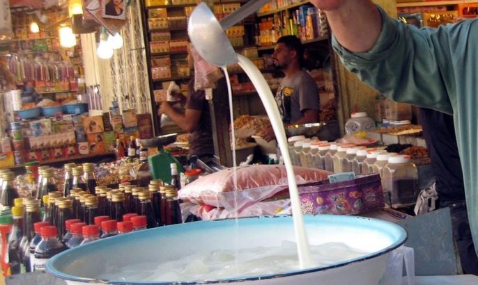 An Iraqi street vendor sells milk during the Islamic holy month of Ramadan in Shorja market, one of the largest markets in Baghdad, Iraq, 04 July 2014. Fighters from the group formerly known as the Islamic State of Iraq and Syria (ISIS) now calling themselves the Islamic State (IS) have made huge gains in recent weeks seizing large parts of Northern and Western Iraq including a string of towns stretching south towards the capital, Baghdad.