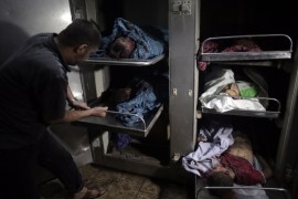 The bodies of five Palestinians killed in an Israeli air strike on a house are seen in the Shifa hospital in Gaza City, Saturday, July 12, 2014. Over a dozen Palestinians were killed in the strike, hospital officials said. Ignoring international appeals for a cease-fire, Israel on Saturday widened its range of Gaza bombing targets to civilian institutions with suspected Hamas ties and announced it would hit northern Gaza "with great force" to prevent rocket attacks from there on Israel. More than 150 Palestinians have been killed in five days of bombardment.(AP Photo/Khalil Hamra)