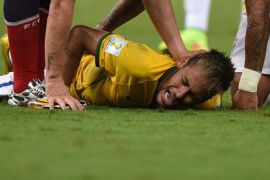 Neymar of Brazil lies on the pitch after picking up an injury during the FIFA World Cup 2014 quarter final match soccer between Brazil and Colombia at the Estadio Castelao in Fortaleza, Brazil, 04 July 2014. (RESTRICTIONS APPLY: Editorial Use Only, not used in association with any commercial entity - Images must not be used in any form of alert service or push service of any kind including via mobile alert services, downloads to mobile devices or MMS messaging - Images must appear as still images and must not emulate match action video footage - No alteration is made to, and no text or image is superimposed over, any published image which: (a) intentionally obscures or removes a sponsor identification image; or (b) adds or overlays the commercial identification of any third party which is not officially associated with the FIFA World Cup) EPA/Marius Becker