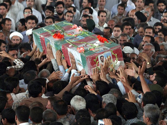 A handout image made available by Iran's FARS News Agency on July 5, 2014, shows mourners attending the funeral of an Iranian pilot at a mosque in the city of Shiraz, on July 4, 2014. According to state media, the pilot, Colonel Shoja'at Alamdari Mourjani, was killed while "defending" Shiite Muslim holy sites in the city of Samarra, north of Baghdad, Iraq, in what is thought to be Tehran's first military casualty during battles against Islamic State jihadists. AFP PHOTO/FARS NEWS/AMIN FAEZI ==== RESTRICTED TO EDITORIAL USE - MANDATORY CREDIT "AFP PHOTO / HO / FARS NEWS/AMIN FAEZI " - NO MARKETING NO ADVERTISING CAMPAIGNS - DISTRIBUTED AS A SERVICE TO CLIENTS ===