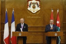 French Foreign Minister Laurent Fabius (L) listens as his Jordanian counterpart Nasser Judeh speaks during their joint news conference at the Ministry of Foreign Affairs in Amman July 19, 2014. REUTERS/Muhammad Hamed (JORDAN - Tags: POLITICS)