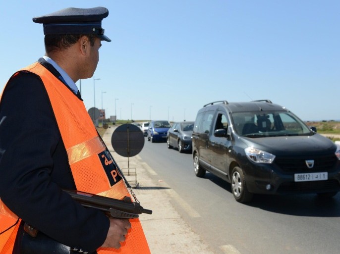 A Moroccan police officer mans a checkpoint at one of the entrances to the city of Rabat, Morocco, 16 March 2014. Spanish Interior Ministry said on 14 March that security forces in Spain and Morocco arrested seven accused members of an Islamist cell recruiting fighters to send to conflict regions, including Syria and Mali. Four people were arrested in southern Spain and three were arrested in Morocco during a joint operation between the countries' police forces.