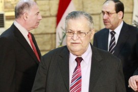 Iraq's President Jalal Talabani (C) leaves as Prime Minister Nuri al-Maliki (R) speaks with parliament speaker Osama al-Nujaifi at the end of a news conference in Baghdad in this November 23, 2010 file photo. Talabani, a Kurd who has been a key player in mediating during the country's political crisis, was hospitalised in Baghdad because of a "health emergency" late Monday night, his office said. Talabani's office gave no details, but the elderly leader has been suffering from ill health this year and has received medical treatment overseas several times in last two years. REUTERS/Thaier al-Sudani/Files (IRAQ - Tags: POLITICS HEALTH)