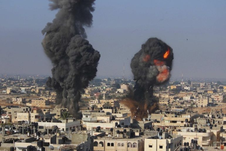 Smoke and flames are seen following what police said was an Israeli air strike in Rafah in the southern Gaza Strip July 9, 2014. At least 23 people were killed across Gaza, Palestinian officials said on Wednesday, by a bombardment Israel said may be just the start of a lengthy offensive against Islamist militants whose rockets struck deeper than ever before into Israel. REUTERS/Stringer (GAZA - Tags: POLITICS CIVIL UNREST TPX IMAGES OF THE DAY)