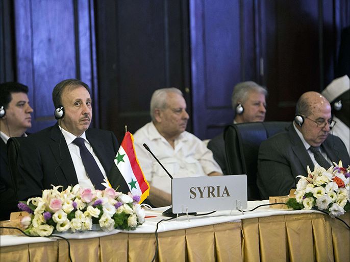 Tehran, -, IRAN : Syria's Parliament speaker Mohammed Jihad al-Laham (L) and Palestinian National Council Chairman Salim al-Zaanun (R) attend a session of the Parliamentary Union of the Organisation of the Islamic Council Member States (PUIC) in Tehran on July 22, 2014. Iranian Parliament speaker, Ali Larijani and his Syrian counterpart condemned "the international silence towards the crimes" of Israeli forces "against innocent civilians in the Gaza Strip", the Syrian news Agency said. AFP PHOTO/BEHROUZ MEHRI