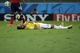 Brazil's Neymar lies on the ground during the World Cup quarterfinal soccer match between Brazil and Colombia at the Arena Castelao in Fortaleza, Brazil, Friday, July 4, 2014. (AP Photo/Hassan Ammar)