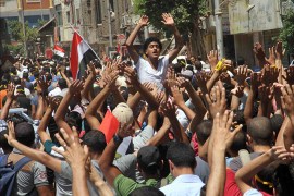 Egyptian supporters of the Muslim Brotherhood movement shout slogans during a rally to mark the first anniversary of the military ouster of president Mohamed Morsi on July 3, 2014 in Cairo's Mattarya district. Egyptian police swiftly quashed Islamist protests firing tear gas and arresting dozens of demonstrators, as the protests are seen as a test of the Islamists' strength, with the Muslim Brotherhood-