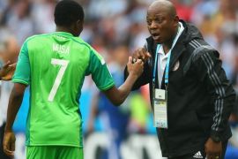 PORTO ALEGRE, BRAZIL - JUNE 25: Ahmed Musa of Nigeria celebrates scoring his team's second goal and his second of the game with head coach Stephen Keshi during the 2014 FIFA World Cup Brazil Group F match between Nigeria and Argentina at Estadio Beira-Rio on June 25, 2014 in Porto Alegre, Brazil.