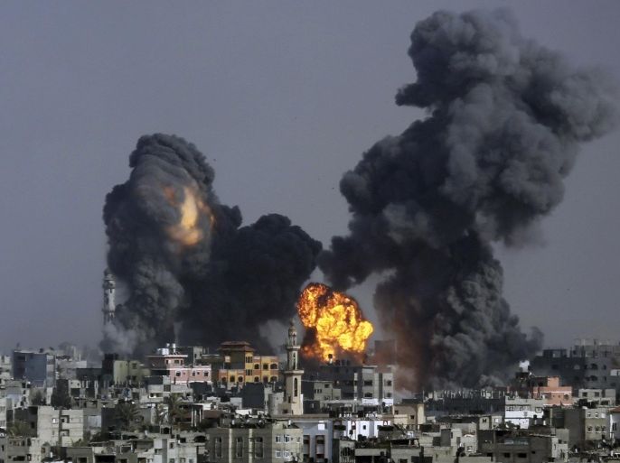Smoke and fire from the explosion of an Israeli strike rise over Gaza City, Gaza Strip, Tuesday, July 22, 2014, as Israeli airstrikes pummeled a wide range of locations along the coastal area and diplomatic efforts intensified to end the two-week war. (AP Photo/Hatem Moussa)