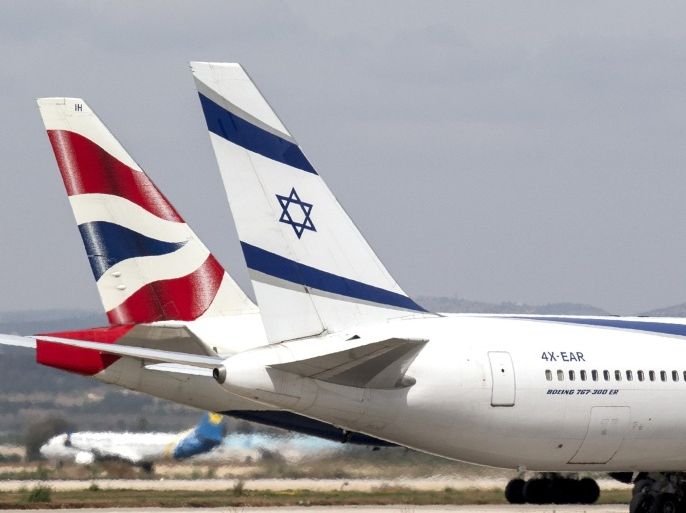 A photo taken on May 19, 2014 shows El-Al (R) and British Airways planes at Israel's Ben Gurion International Airport. AFP PHOTO / JACK GUEZ