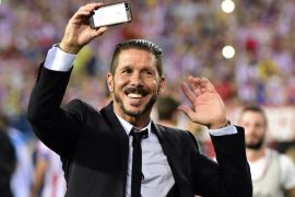 Atletico Madrid's Argentinian coach Diego Simeone celebrates after winning the Super Cup at the end of the Spanish Supercopa second-leg football match Atletico de Madrid vs Real Madrid CF at the Vicente Calderon Stadium in Madrid on August 22, 2014. Atletico de Madrid won 1-0. AFP PHOTO/ GERARD JULIEN