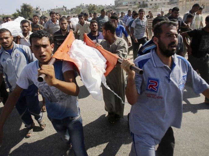 Mourners carry the body of a Palestinian from Abu Hadaf family, whom medics said was killed along with two other family members by an Israeli air strike, during their funeral in Khan Younis in the southern Gaza Strip August 9, 2014. Israel launched more than 20 aerial attacks in Gaza early on Saturday and militants fired several rockets at Israel in a second day of violence since a failure to extend an Egyptian-mediated truce that halted a monthlong war earlier this week. The Israeli military said that since midnight it had attacked more than 20 sites in the coastal enclave where Hamas Islamists are dominant, without specifying the targets. Medical officials in Gaza said two Palestinians were killed when their motorcycle was bombed and the bodies of three others were found beneath the rubble of one of three bombed mosques. The air strikes which lasted through the night also bombed three houses, and fighter planes also strafed open areas, medical officials said. REUTERS/Ibraheem Abu Mustafa (GAZA - Tags: POLITICS CIVIL UNREST MILITARY CONFLICT TPX IMAGES OF THE DAY)