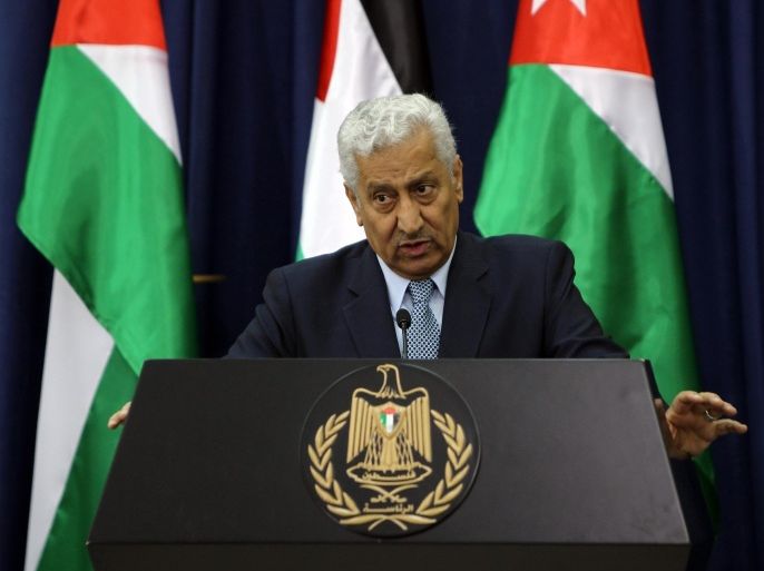 Jordanian Prime Minister Abdullah Nsur speaks to the press as Palestinian president Mahmud Abbas (unseen) listens on following their meeting in the West Bank city of Ramallah, on April 23, 2014. AFP PHOTO / ABBAS MOMANI