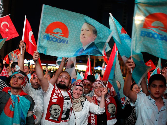 Supporters of Turkey's Prime Minister Tayyip Erdogan celebrate his election victory in front of the party headquarters in Ankara August 10, 2014. Erdogan is set to be Turkey's next president after local media credited the veteran prime minister with more than half the vote in a near-complete count and allies said Erdogan had won. REUTERS