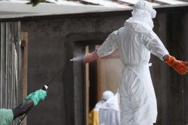 A photograph made available 03 August 2014 shows a Liberian nurse in protective clothing being sprayed with disinfectant after preparing several bodies of victims of Ebola for burial in the isolation unit of the ELWA Hospital in Monrovia, Liberia 01 August 2014. World Health Organization head Margaret Chan told leaders of West African nations affected by the Ebola outbreak who meet in Guinea to launch a 75 million euro response plan that the outbreak is spreading faster than efforts to control it. Over 729 people have died of Ebola in West Africa in 2014 making it the world's deadliest outbreak to date according to statistics from the United Nations.