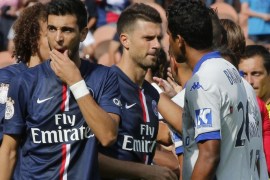 Paris Saint Germain's Thiago Motta, center and Bastia's Brandao, right, greets each other prior to the kick-off of a French League One soccer Match Paris Saint Germain against Bastia, while Argentinian Javier Pastore,left, stands next to them, at Parc des Princes stadium, in Paris, Saturday, Aug. 16. 2014. Paris Saint-Germain President Nasser Al-Khelaifi wants Brandao to be banned for life after the Bastia striker headbutted Thiago Motta at the end of a French league match on Saturday. After Bastia's 2-0 loss to PSG, Brandao waited for Thiago Motta in the tunnel and headbutted the midfielder, leaving him with blood running down from his nose. Al-Khelaifi said the Italian had a broken nose, although the club had not disclosed any injury details. (AP Photo/Michel Euler)