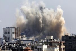 Smoke and dust rise over Gaza City after an Israeli strike, Friday, Aug. 8, 2014, as Israel and Gaza militants resumed cross-border attacks after a three-day truce expired and Egyptian-brokered talks on a new border deal for blockaded Gaza hit a deadlock. (AP Photo/Hatem Moussa)