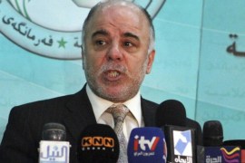 FILE - In this Saturday, Dec. 5, 2009 file photo, Shiite lawmaker Haider al-Abadi speaks to the press after an Iraqi Parliament session about the election law in Baghdad, Iraq. On Monday, Aug. 11, 2014, Iraq's largest coalition of Shiite political parties chose the Deputy Parliament Speaker Haider al-Ibadi to be its candidate to lead the government in a major defeat for incumbent Prime Minister Nouri al-Maliki just hours after he declared himself the rightful candidate and put troops on the street. Critics say the Shiite al-Maliki contributed to the crisis by monopolizing power and pursuing a sectarian agenda that alienated the country's Sunni and Kurdish minorities. (AP Photo/Karim Kadim, File)