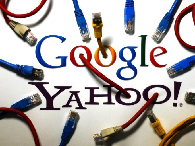 An illustration picture shows the logos of Google and Yahoo connected with LAN cables in a Berlin office October 31, 2013. REUTERS/Pawel Kopczynski