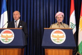 French Foreign Affairs Minister Laurent Fabius (L) speaks during a news conference with Iraqi Kurdish regional President Masoud Barzani in Arbil, north of Baghdad, August 10, 2014. Fabius visited the capital of Iraqi Kurdistan after his country said it was ready to support the region's forces in blocking the incursion of Islamic State militants. REUTERS/Azad Lashkari (IRAQ - Tags: POLITICS)