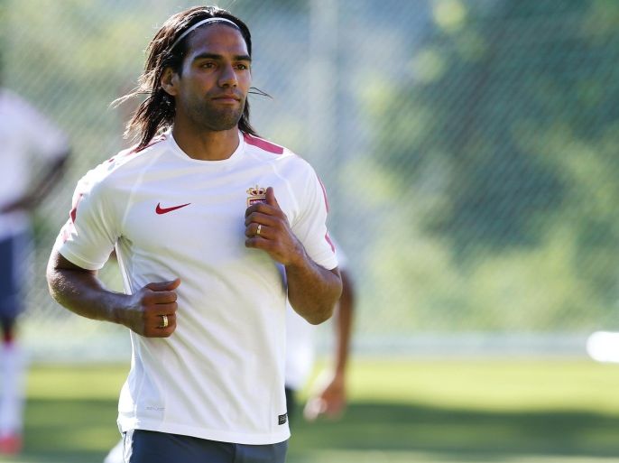 Monaco's Colombian forward Radamel Falcao runs during Monaco's (ASM) first team training session on June 30, 2014 at the Monaco training camp in La Turbie, southeastern France, ahead the 2014/2015 French L1 football season beginning on August 9. AFP PHOTO / VALERY HACHE