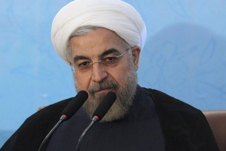 In this photo released by the official website of the office of the Iranian Presidency, Iran's President Hassan Rouhani attends an annual meeting of Iranian ambassadors, in Tehran, Iran, Monday, Aug. 11, 2014. Rouhani has offered his harshest criticism yet of hard-liners opposed to making a deal over its contested nuclear program with world powers, saying they should go "to hell." (AP Photo/Mohammad Berno, Iranian Presidency Office)