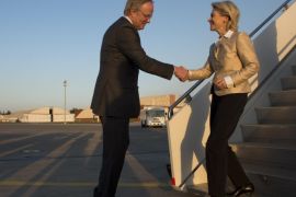 German Defence Minister Ursula von der Leyen (R) is welcomed by Germany's ambassador in Turkey Eberhard Pohl upon her arrival in Turkey on March 24, 2014, where she will visit German troops operating Patriot anti-missile defence installations, as part of a NATO-led initiative near the Turko-Syrian border. AFP PHOTO / JOHN MACDOUGALL