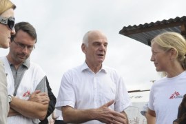 Senior United Nations (U.N.) System Coordinator for Ebola, David Nabarro (C), talks with a Medicins Sans Frontieres (MSF) health worker during his visit, outside the ELWA's hospital isolation unit in Monrovia August 23, 2014. As the outbreak has spread across borders from its initial epicentre in Guinea, governments in the region have introduced increasingly strict travel restrictions. Ivory Coast has closed its land borders Guinea and Liberia to try to prevent the virus from crossing onto its territory, the government announced late on Friday. REUTERS/2Tango (LIBERIA - Tags: HEALTH SOCIETY DISASTER)