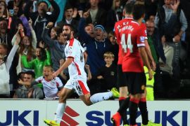 MK Dons' Will Grigg jubilates after scoring a second goal against Manchester United during the League Cup Second Round match at Stadium:mk, Milton Keynes, England, Tuesday Aug. 26, 2014. MK Dons defeated Manchester United 4-0. (AP Photo/PA, Nick Potts) UNITED KINGDOM OUT NO SALES NO ARCHIVE