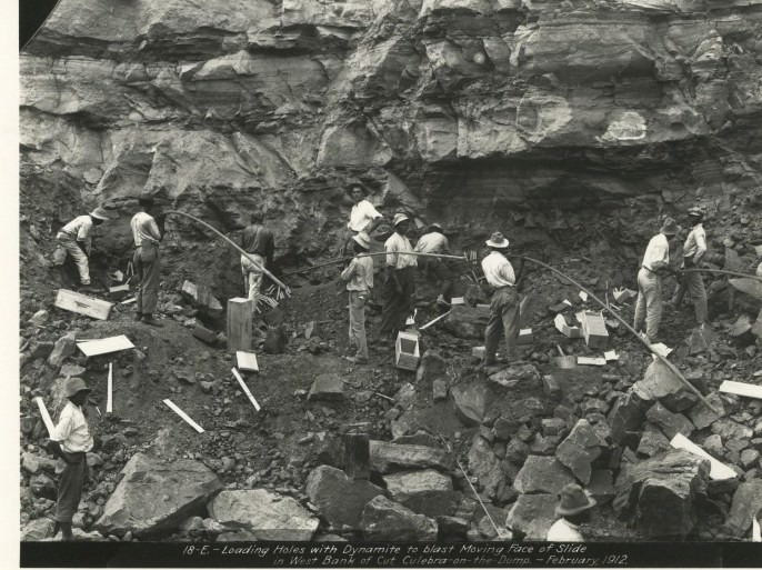 Workers load holes with dynamite to blast part of the Culebra Cut along the Panama Canal in this February 1912 archival handout photo obtained by Reuters August 14, 2014. The 100th anniversary of the opening of the Panama Canal (August 15) hailed at the time as one of the world's great wonders, has inspired a celebration in central Florida to showcase the experience of the U.S. canal workers behind the engineering feat. REUTERS/Panama Canal Museum Collection/George A. Smathers Libraries/University of Florida/Handout via Reuters (UNITED STATES - Tags: ANNIVERSARY SCIENCE TECHNOLOGY TRANSPORT MARITIME) ATTENTION EDITORS - THIS PICTURE WAS PROVIDED BY A THIRD PARTY. REUTERS IS UNABLE TO INDEPENDENTLY VERIFY THE AUTHENTICITY, CONTENT, LOCATION OR DATE OF THIS IMAGE. FOR EDITORIAL USE ONLY. NOT FOR SALE FOR MARKETING OR ADVERTISING CAMPAIGNS. THIS PICTURE IS DISTRIBUTED EXACTLY AS RECEIVED BY REUTERS, AS A SERVICE TO CLIENTS. NO SALES. NO ARCHIVES