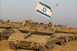 Israeli tanks are seen in a staging area near the border with the Gaza Strip August 7, 2014. Mediators worked against the clock on Thursday to extend a Gaza truce between Israel and the Palestinians as the three-day ceasefire went into its final 24 hours. Israel has said it is ready to agree to an extension as Egyptian mediators pursued talks with Israelis and Palestinians on an enduring end to a war that devastated the Hamas-ruled enclave, while Palestinians want an Israeli-Egyptian blockade of Gaza to be lifted and prisoners held by Israel to be freed. Gaza officials say the war has killed 1,874 Palestinians, most of them civilians. Israel says 64 of its soldiers and three civilians have been killed since fighting began on July 8, after a surge in Palestinian rocket salvoes into Israel REUTERS/ Amir Cohen (ISRAEL - Tags: POLITICS CIVIL UNREST MILITARY)