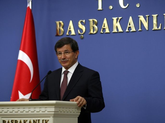 Turkish Prime Minister Ahmet Davutoglu announces his new cabinet in Ankara August 29, 2014. Turkish Prime Minister Ahmet Davutoglu announced his new cabinet on Friday, keeping key members of the country's economic management team in place and appointing the man who has managed its affairs with Europe as foreign minister. REUTERS/Umit Bektas (TURKEY - Tags: POLITICS)