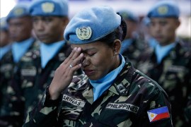 epa03321265 A Filipino female soldier as part of the United Nations (UN) Peace Keeping Force to Liberia gestures during send off ceremony inside a military base in Taguig city, south of Manila, Philippines, 28 July 2012. The Philippine contingent is tasked to assist in the maintenace of law and order in Liberia following a ceasefire that ended the Second Liberian Civil War. EPA