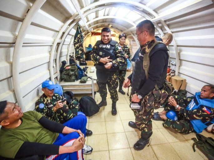 (FILE) A file picture dated 11 May 2014 shows Filipino peacekeepers rest inside a bunker at Golan Heights Syria. Filipino peacekeepers in the Golan Heights were prepared to defend their positions against Syrian rebels as UN officials worked to end the standoff, the Philippine military said on August 29, 2014. Seventy-five Filipino soldiers, located in two positions in the separation zone between Syria and the Israeli-occupied Golan Heights, had refused to give up their arms, said spokesman Major General Domingo Tutaan. The Philippines has a total of 331 soldiers and police officers deployed with the UN Disengagement Force in the Golan Heights. The Syrian rebels had disarmed and captured 43 Fijian peacekeepers in the area separating Syria and Israel. The United Nations said 28 August it was working to secure their release. Manila earlier announced it was recalling Filipino forces at the end of their tour of duty in October.