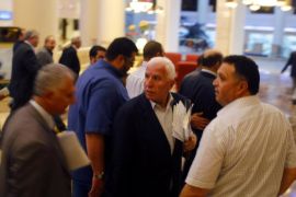 Fatah official and delegation leader Azzam Ahmed (C) and other Palestinian negotiators arrive at a hotel after negotiations in Cairo August 13, 2014. The threat of renewed war in Gaza loomed on Wednesday as the clock ticked toward the end of a three-day ceasefire with no sign of a breakthrough in indirect talks in Cairo between Israel and the Palestinians. REUTERS/Asmaa Waguih (EGYPT - Tags: POLITICS CONFLICT CIVIL UNREST)