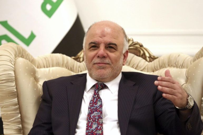 Iraq's Prime Minister-designate Haider al-Abadi smiles during a meeting German's Foreign Minister Frank-Walter Steinmeier in Baghdad August 16, 2014. Steinmeier arrived in Baghdad on Saturday for talks with Iraqi officials on what could be done to help the country in its fight against insurgents of the Islamic State. REUTERS/Hadi Mizban/Pool (IRAQ - Tags: CIVIL UNREST POLITICS CONFLICT)